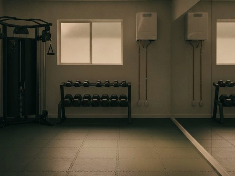 Home gym with exercise equipment, mats, and a window
